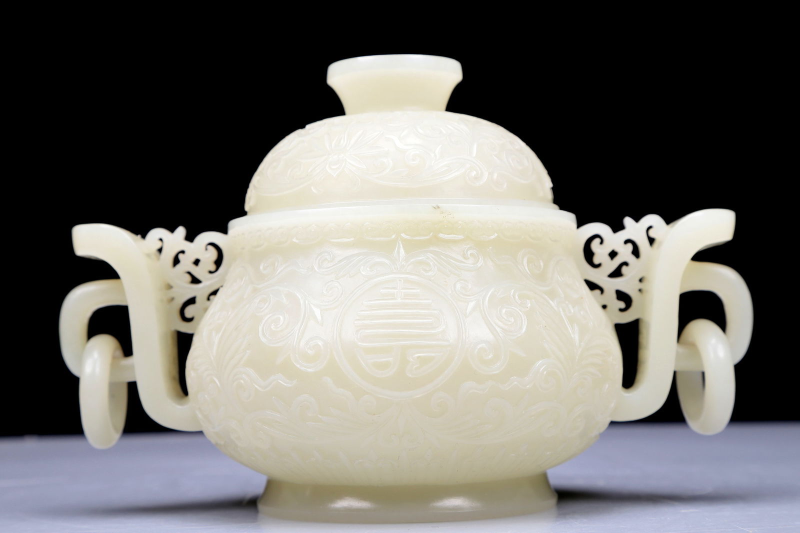 A Precious White Jade 'Scrolling Lotus' Censer And Cover: A Precious White Jade 'Scrolling Lotus' Censer And Cover. Supported on a subtly splayed foot, body carved with scrolls, handles with suspending, loose rings. Chinese Qing Dynasty. Size:7.1inx4.7inx4.7
