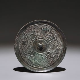 An Archaic Bronze Feather Pattern Round Mirror