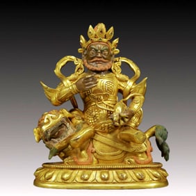 A Solemn Gilt Bronze Statue of Mammon Rides the Lion