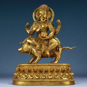 A Solemn Gilt Bronze Statue of Ganesh