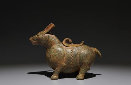 An Archaic Bronze Auspicious Beast-Shaped Zun