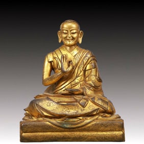 A Solemn Gilt Bronze Statue of Guru