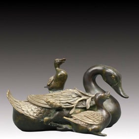 A Solemn Bronze Swan Ornament
