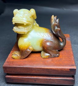 An Exquisite White Jade Auspicious Beast Hand Piece