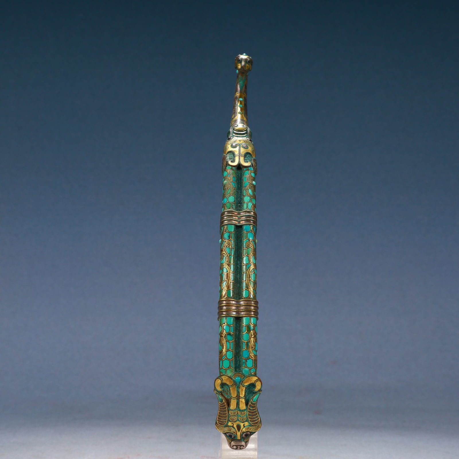 An Archaic Bronze Inlaid Gold Beast-head Hook,Inlaid Turquoise,With Inscription: An Archaic Bronze Inlaid Gold Beast-head Hook,Inlaid Turquoise,With Inscription,Qing Dynasty, China,Size:9.8inx0.8inx1.6in,Weight:350g 青铜错金兽首带钩,