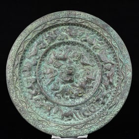 An Archaic Bronze Animal Pattern Round Mirror