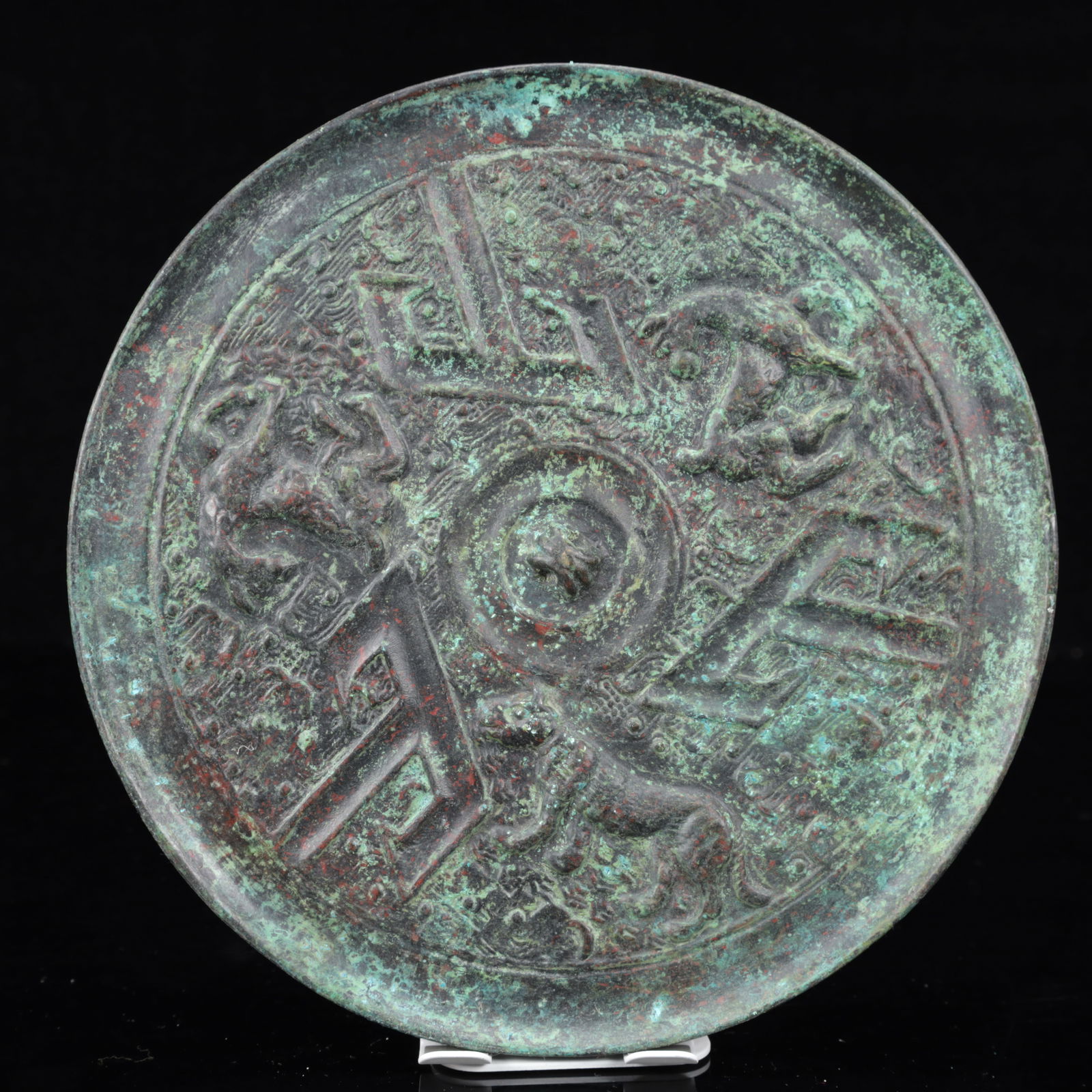 An Archaic Bronze Animal Pattern Round Mirror: An Archaic Bronze Animal Pattern Round Mirror,The Warring States period in China,Size:8.3inx0.6in,Weight:1150g 