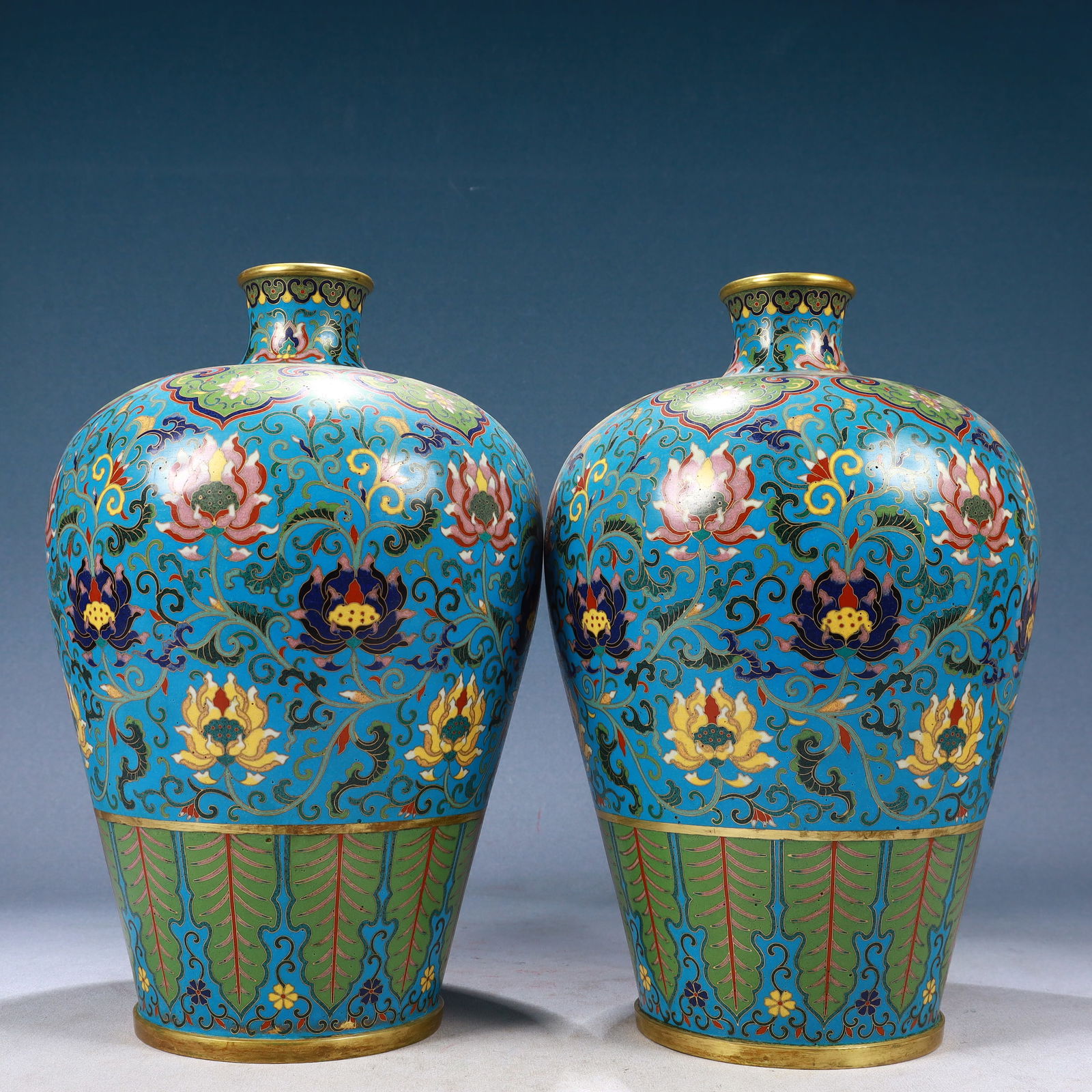 A Pair of Rare Cloisonne Lotus Pattern Vases: A Pair of Rare Cloisonne Lotus Pattern Vases,Qing Dynasty, China,Qianlong Four-character Mark,Size:7.9inx13in,Weight:6550g 一对景泰蓝缠枝莲纹ī