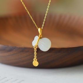 An Exquisite Sterling Silver-Gold Plated Inlaid White Jade Pendant