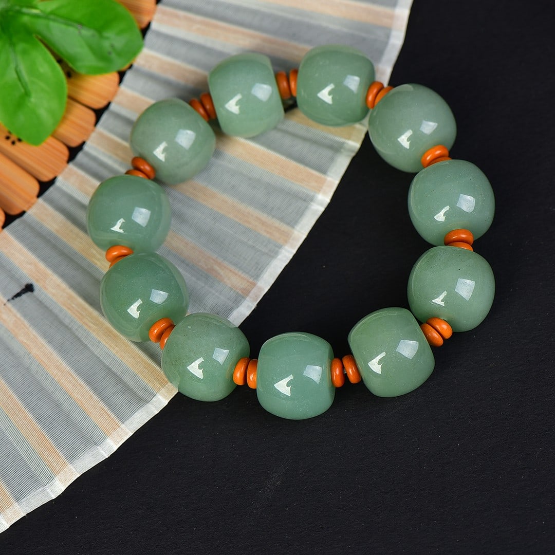 An Exquisite Greenish Jade Bracelets: An Exquisite Greenish Jade Bracelets,Size:0.6inx0.7in 青玉手串
