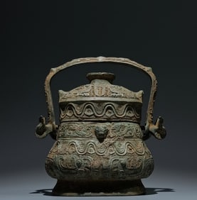 An Archaic Bronze Phoenix Pattern Beast-Ears Ewer