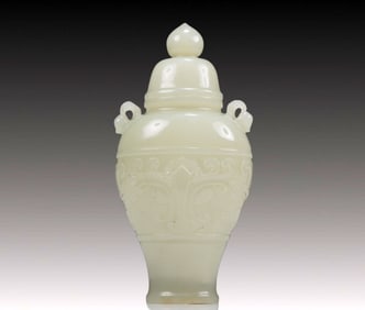 An Exquisite White Jade 'Animal Mask' Vase And Cover