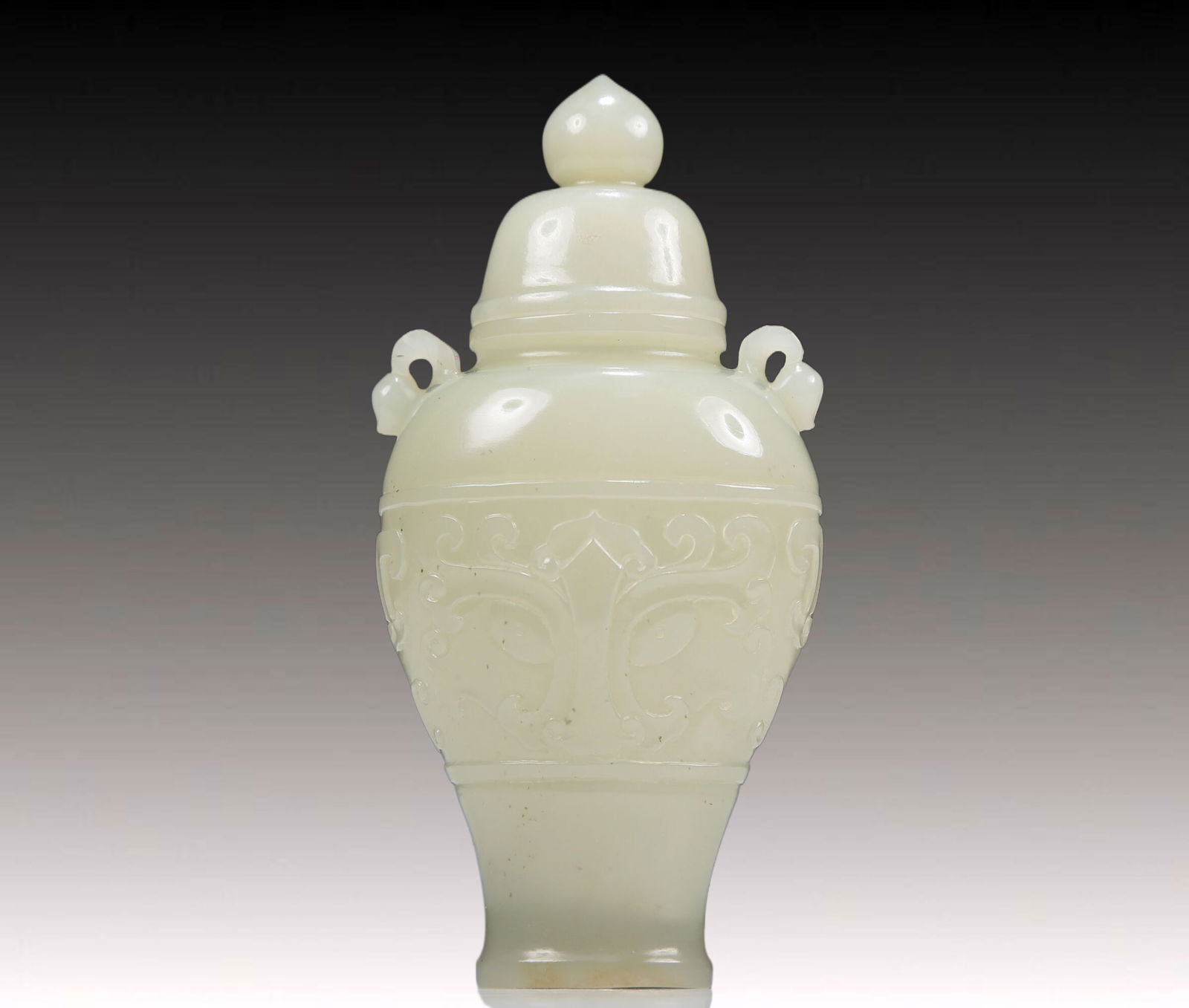 An Exquisite White Jade 'Animal Mask' Vase And Cover (1 of 7)