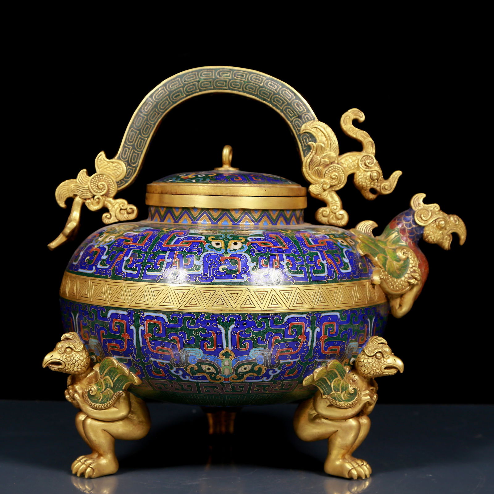 A Rare Cloisonne Beast-Face Pattern Tripod Phoenix Head Ewer: A Rare Cloisonne Beast-Face Pattern Tripod Phoenix Head Ewer,Qing Dynasty, China,Qianlong Four-character Mark,Size:11.4inx7.9inx11.8in,Weight:7.10kg 景泰蓝兽面纹