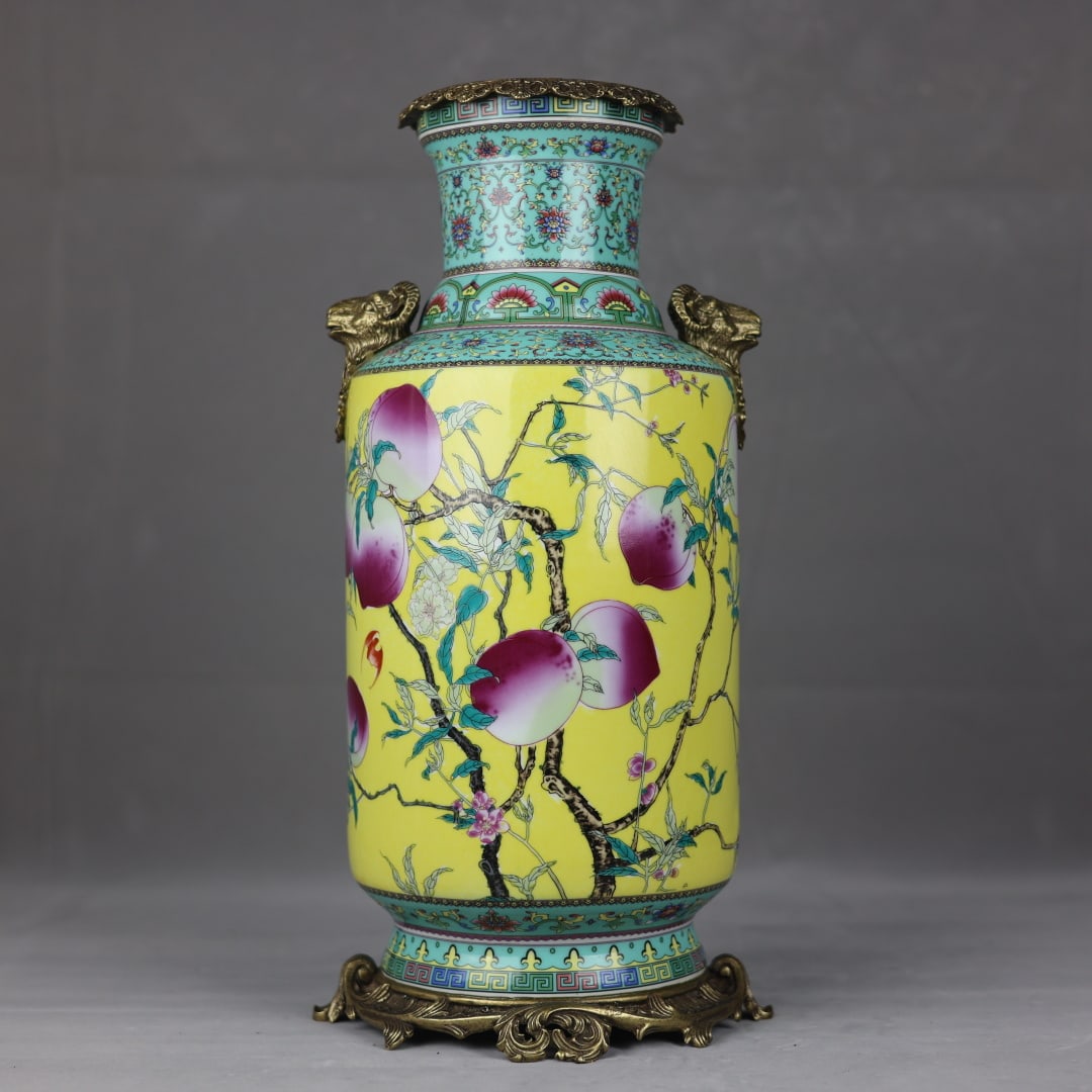 A Huge Yellow Ground Famille-Rose Inlaid Bronze Bats and Peach Pattern Goat-Ears Vase,With Poem: A Huge Yellow Ground Famille-Rose Inlaid Bronze Bats and Peach Pattern Goat-Ears Vase,With Poem,Qing Dynasty, China,Qianlong Four-character Mark,Size:44.5cmx13cmx18cmx22.5cm 