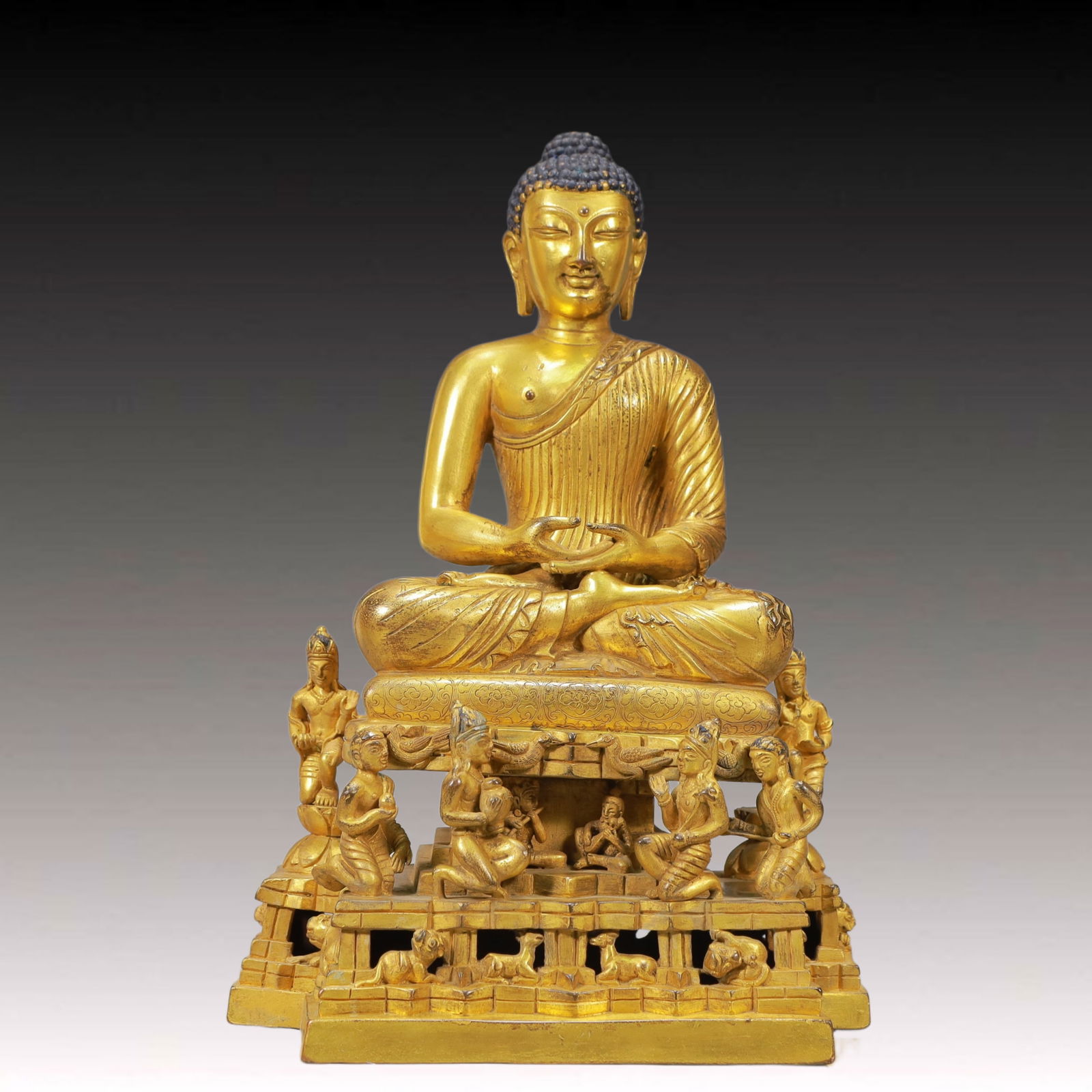 A Solemn Gilt Bronze Statue of Sakyamuni: A Solemn Gilt Bronze Statue of Sakyamuni,Ming Dynasty, China,Size:23cmx13.5cmx33.5cm,Weight:6500g 铜鎏金释迦摩尼像,中国明代