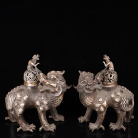 A Pair of Exquisite Silver Lion Ornaments
