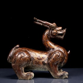 A Rare Bronze Inlaid Gold and Silver Auspicious Beast Ornament