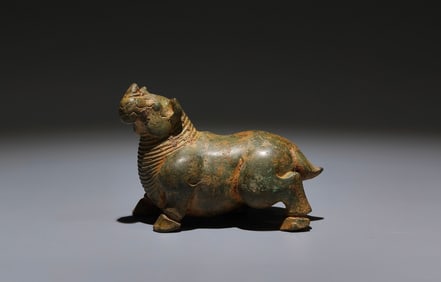 An Archaic Bronze Rhinoceros Ornament
