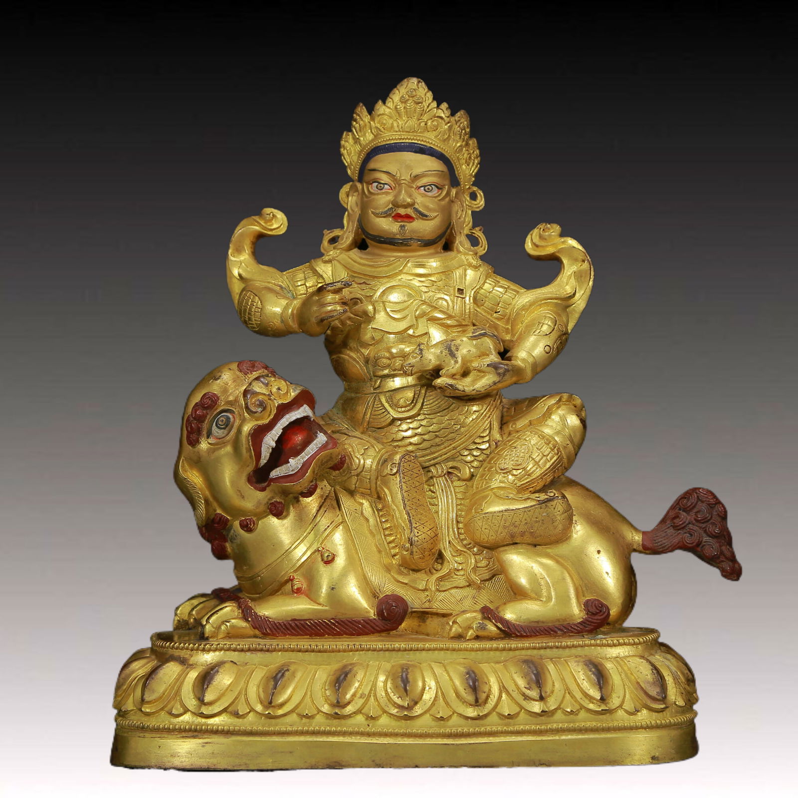 A Solemn Gilt Bronze Statue of Mammon Rides the Lion: A Solemn Gilt Bronze Statue of Mammon Rides the Lion,Ming Dynasty, China,Size: 18cmx9cmx21cm,Weight:2830g 铜鎏金骑狮财神像，明代