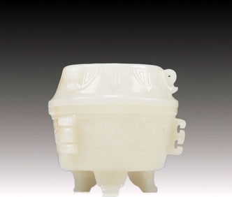 An Exquisite White Jade 'Auspicious Beast' Tripod Box And Cover