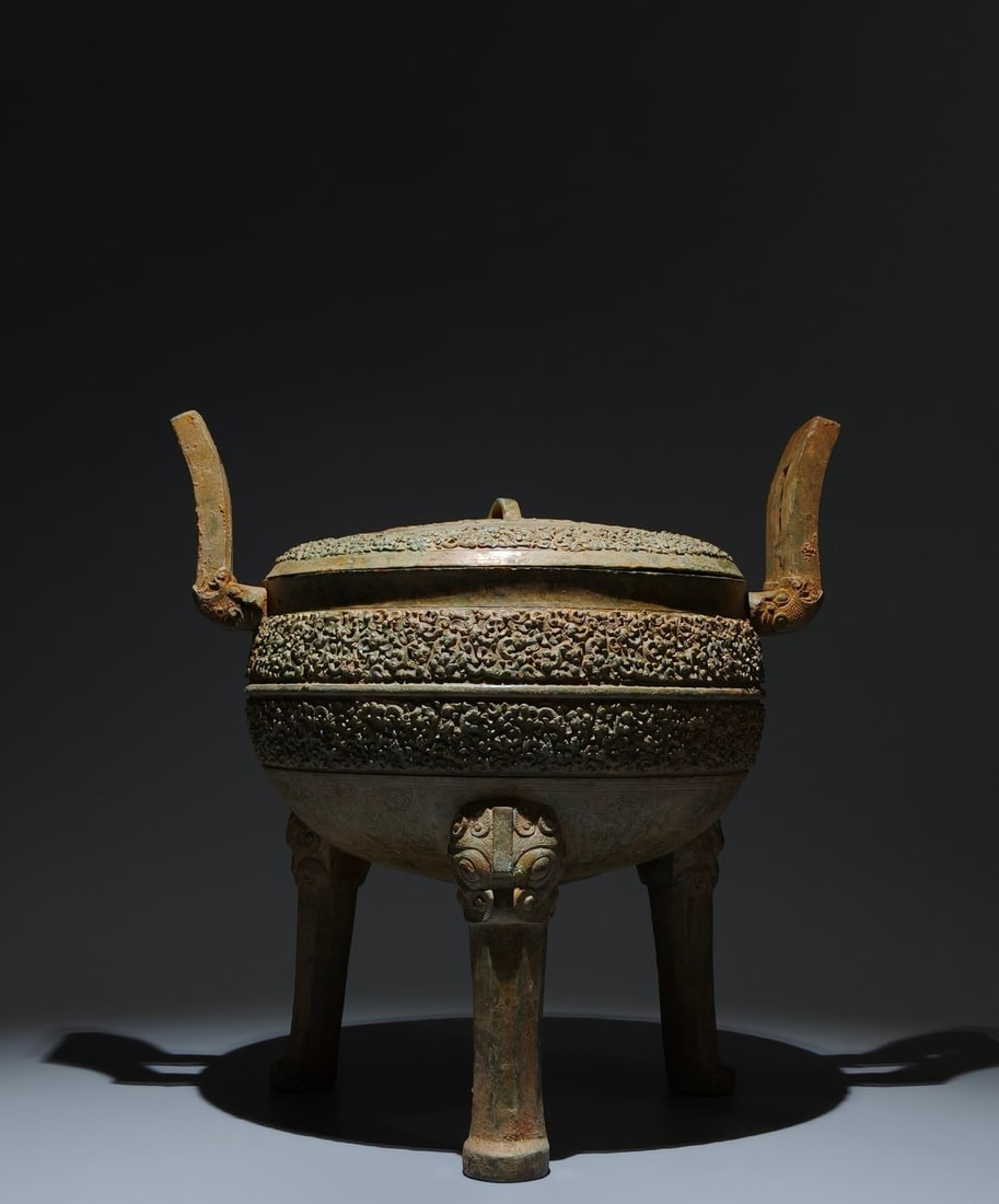 An Archaic Bronze Chi-Dragon Pattern Double-Ears and Tripod Food Vessel: An Archaic Bronze Chi-Dragon Pattern Double-Ears and Tripod Food Vessel,the Warring States period in China,Size:13.8inx13.4inx9.8in 青铜螭龙纹双耳三$