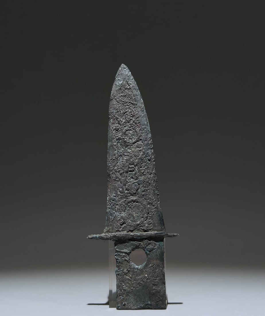 An Archaic Bronze Auspicious Beast Pattern Weapon: An Archaic Bronze Auspicious Beast Pattern Weapon,Shang Dynasty, China,Size:22cmx8cm 青铜瑞兽纹兵器,中国商代