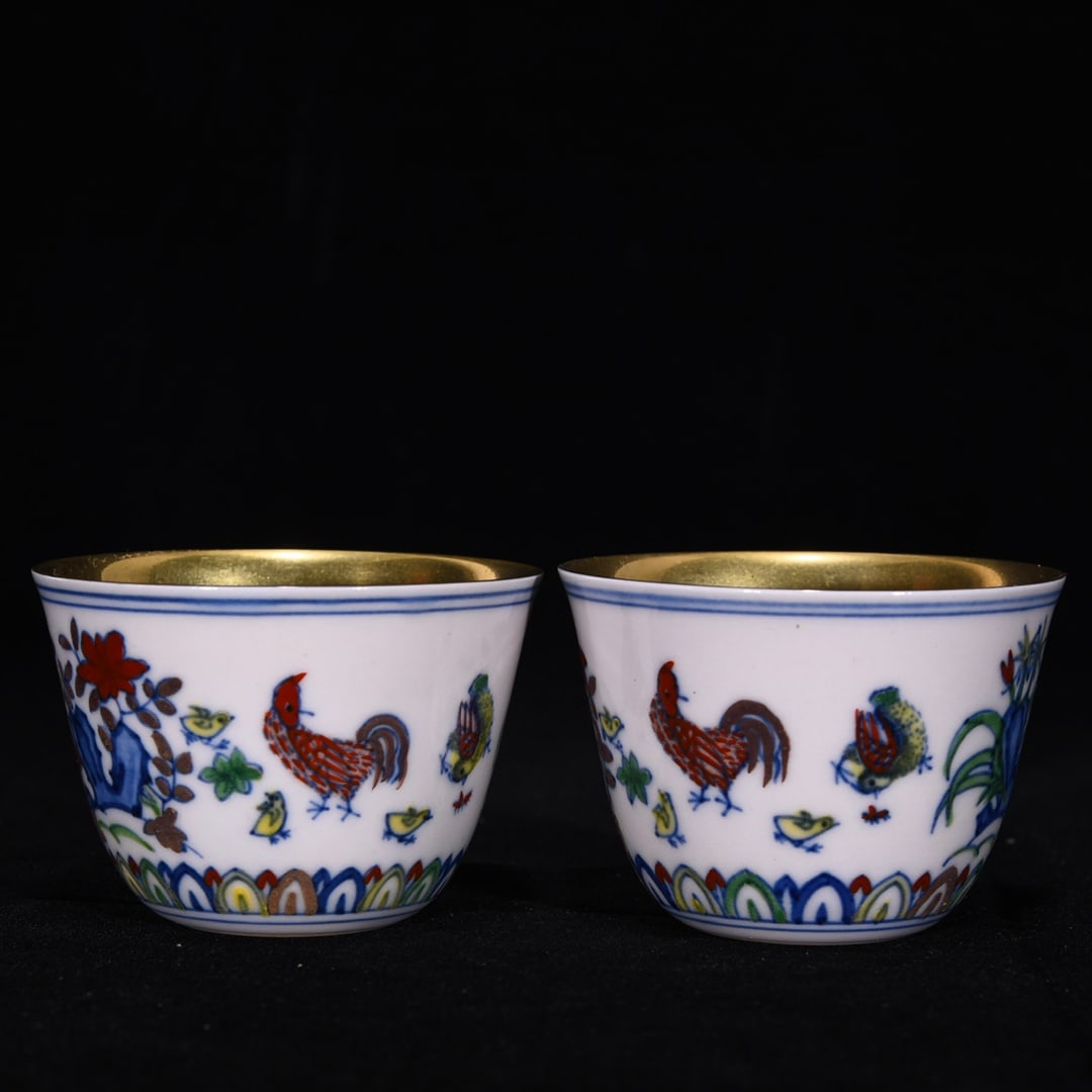 A Pair of Exquisite Doucai Gilding Flower and Rooster Pattern Cups: A Pair of Exquisite Doucai Gilding Flower and Rooster Pattern Cups,Ming Dynasty, China,Chenghua Six-character Mark,Size:5cmx7.5cm 