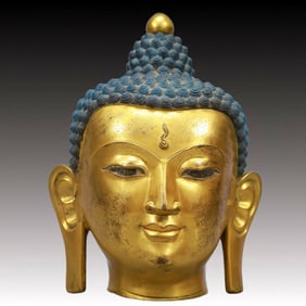 A Solemn Gilt Bronze Buddha Head Ornament