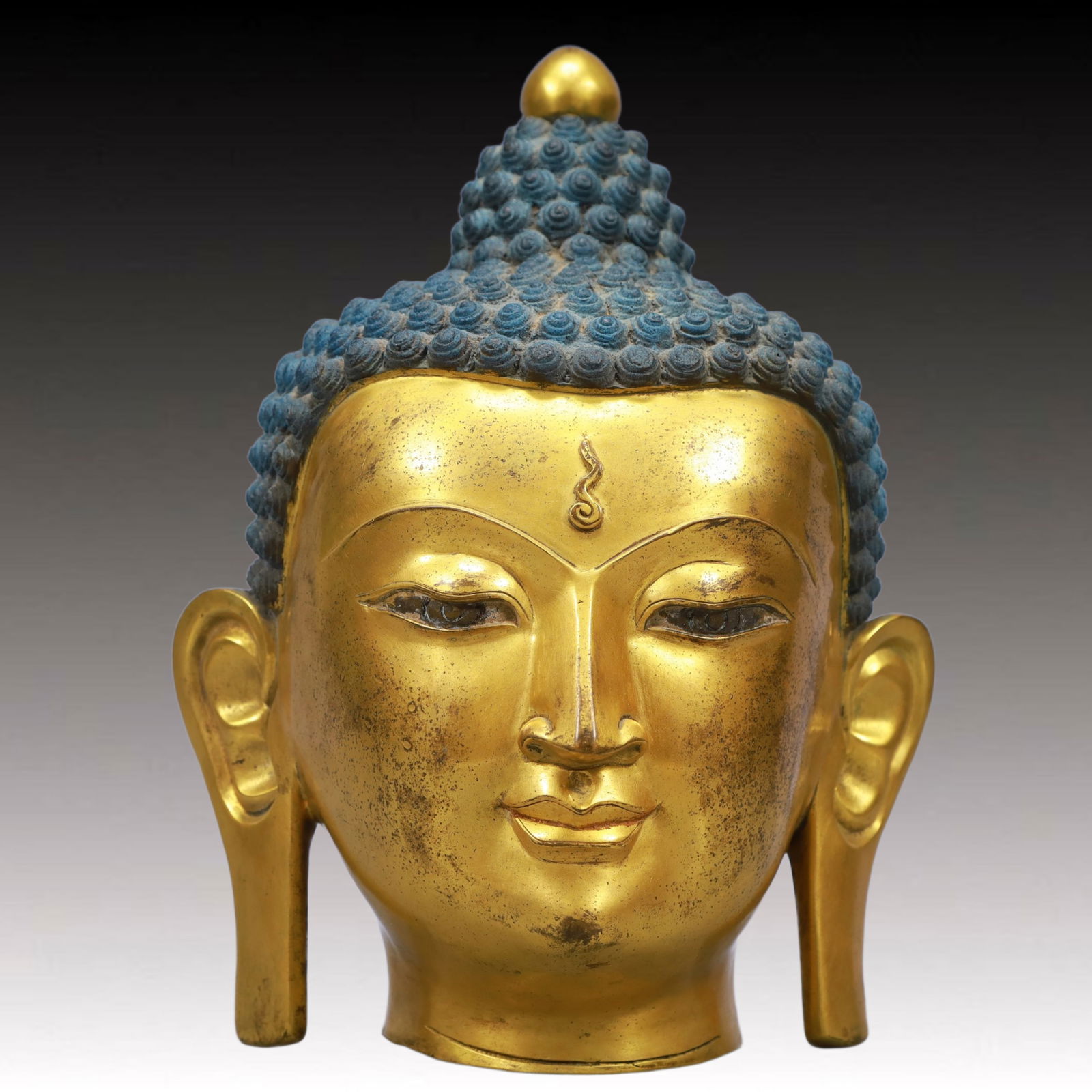 A Solemn Gilt Bronze Buddha Head Ornament (1 of 10)
