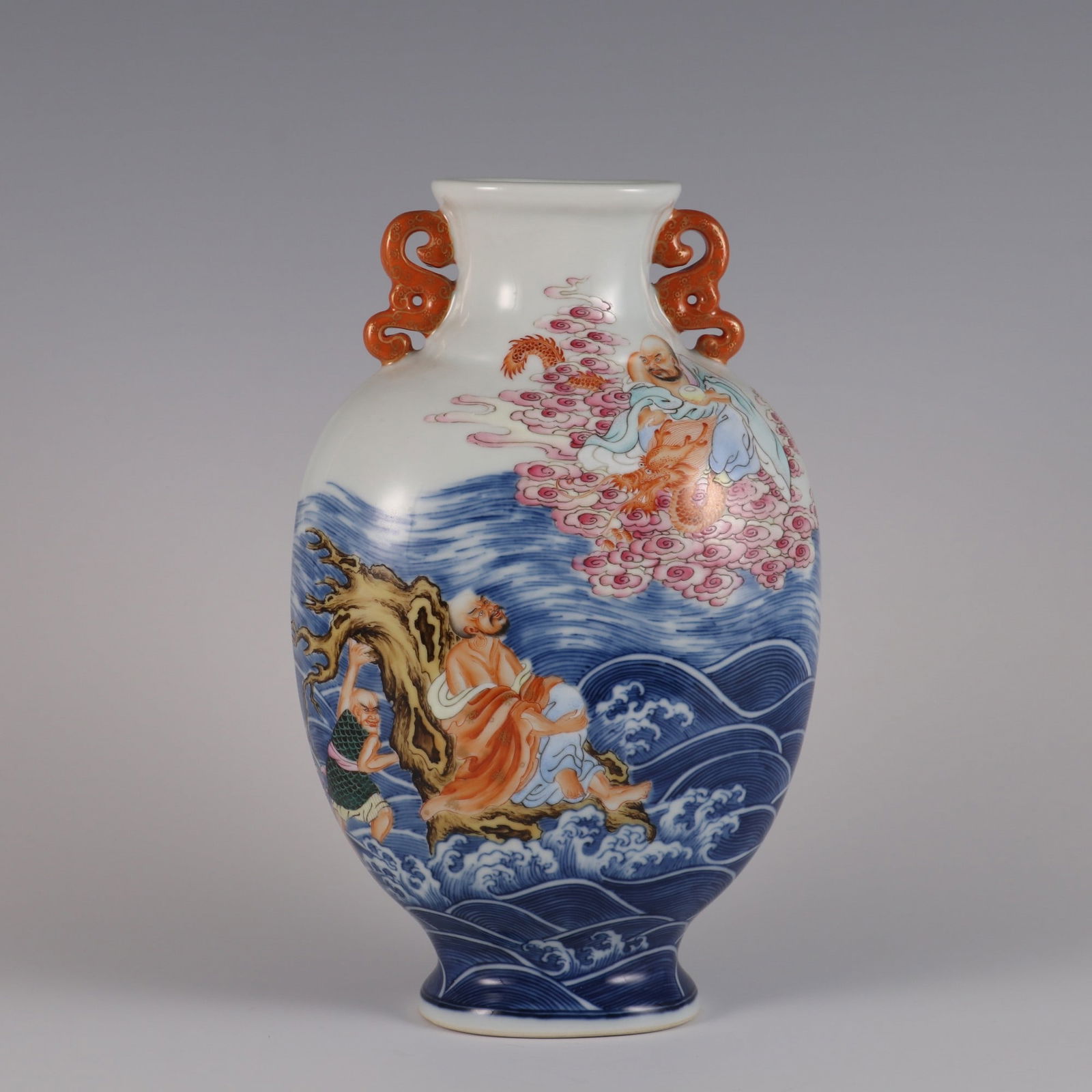An Exquisite Blue and White Famille-Rose Seawater and Arhat Pattern Double-Ears Vase: An Exquisite Blue and White Famille-Rose Seawater and Arhat Pattern Double-Ears Vase,Qing Dynasty, China,Yongzheng Six-character Mark,Size:25.8cmx15.5cmx7.3cm 