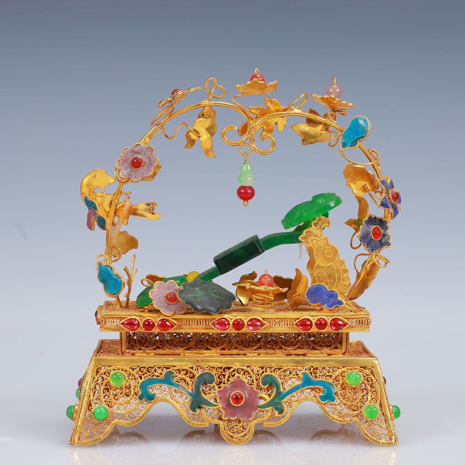 An Exquisite Filigree and Gilding Inlaid Jadeite Ruyi Ornament,Inlaid Gems: An Exquisite Filigree and Gilding Inlaid Jadeite Ruyi Ornament,Inlaid Gems,Qing Dynasty, China,Qianlong Four-Character Mark,Size:5.5inx3.1inx6.7in,Weight:435g 花丝鎏金嵌&