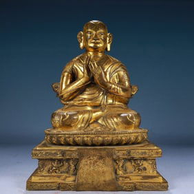 A Solemn Gilt Bronze Statue of Guru