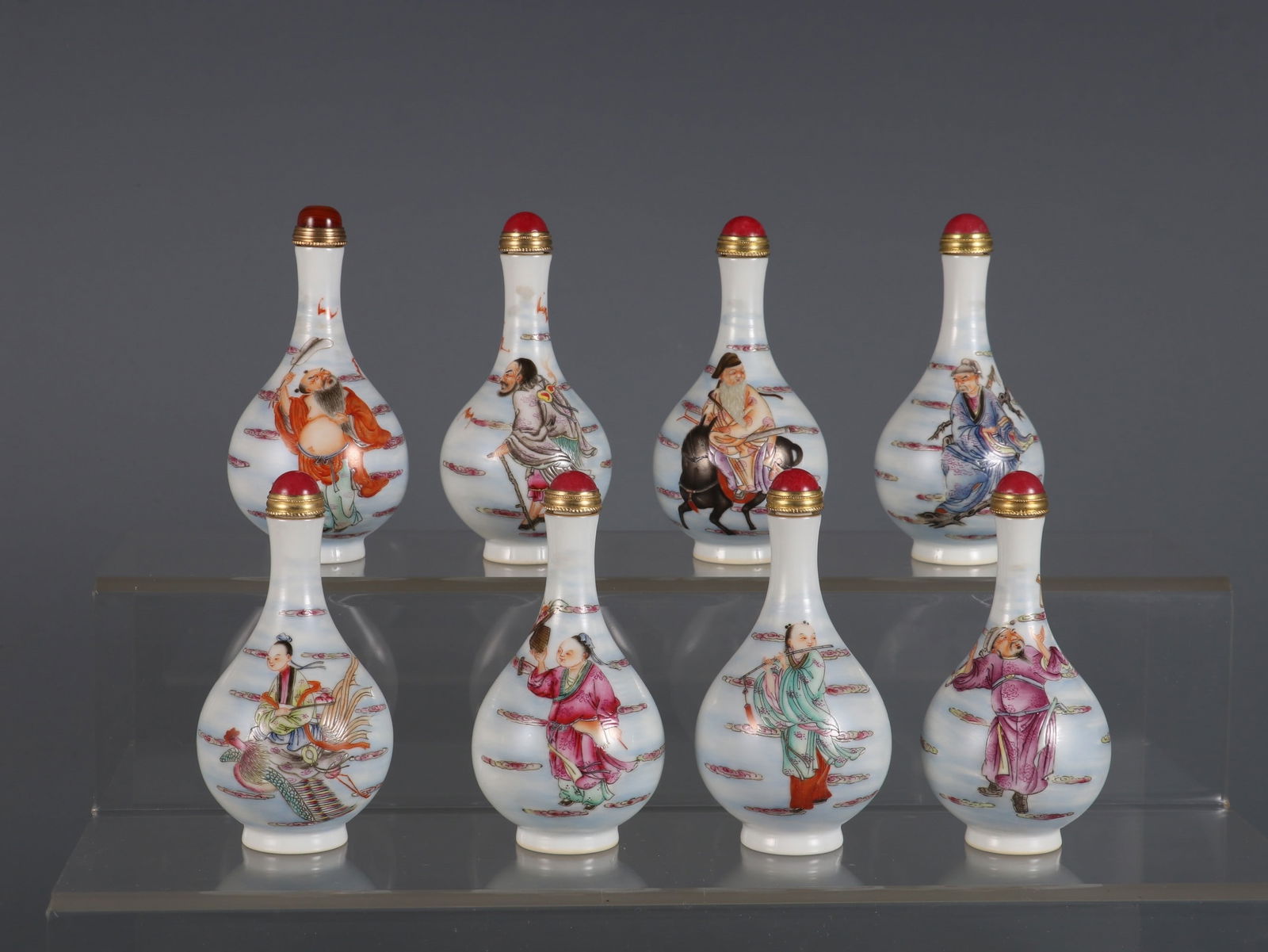 A Set of Fine Famille-Rose Auspicious Cloud and Figure Pattern Snuff Bottles,With Poem (1 of 9)