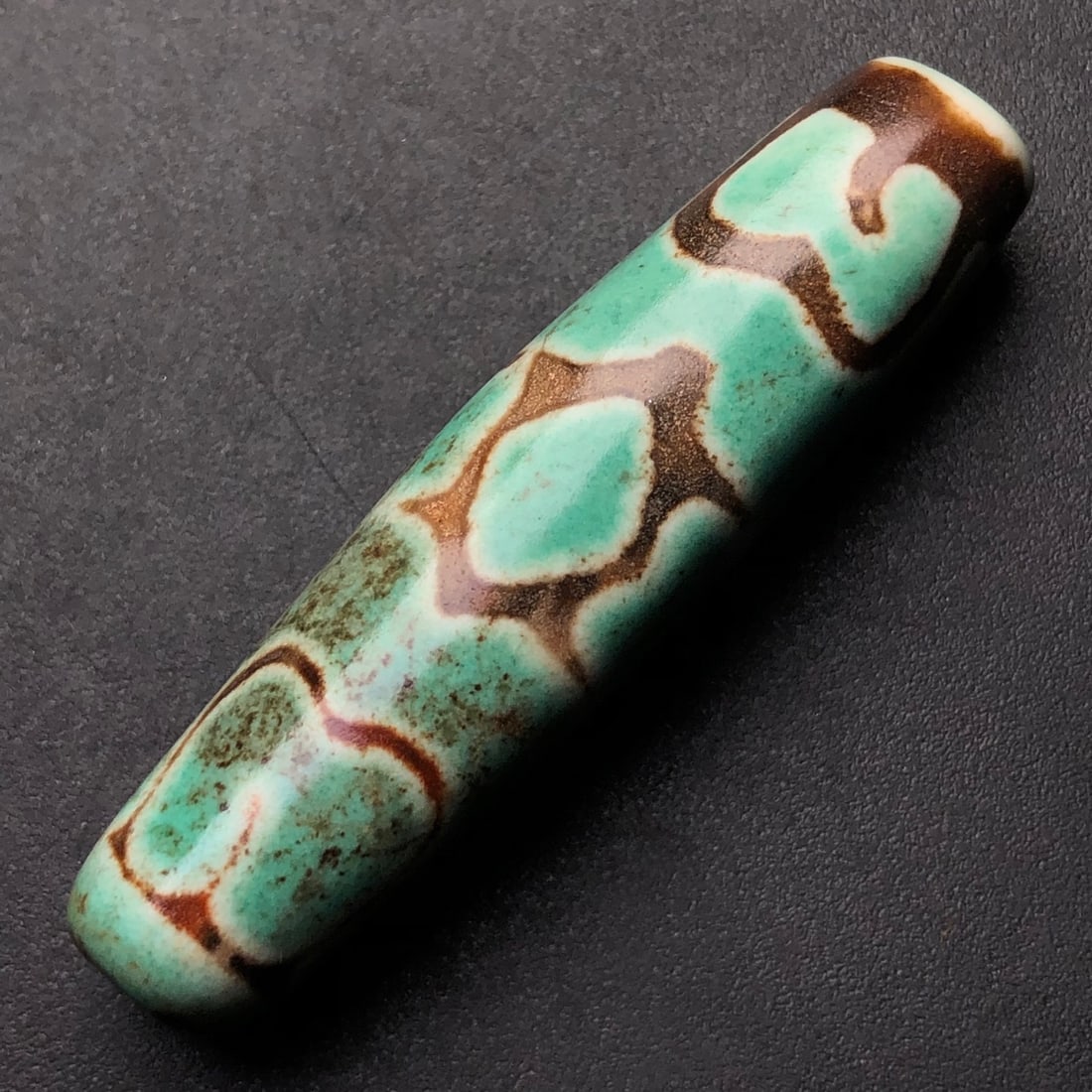 An Exquisite Dzi Bead Pendant: An Exquisite Dzi Bead Pendant,Size:48mmx12mm,Weight:10g 天珠挂件