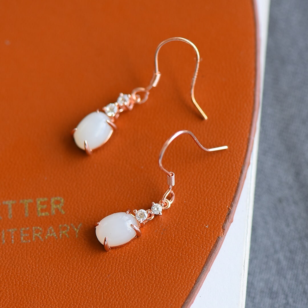 A Pair of Exquisite Sterling Silver-Gold Plated Inlaid White Jade Earrings: A Pair of Exquisite Sterling Silver-Gold Plated Inlaid White Jade Earrings,Size:6mmx8mm 一对纯银镀金镶白玉耳环