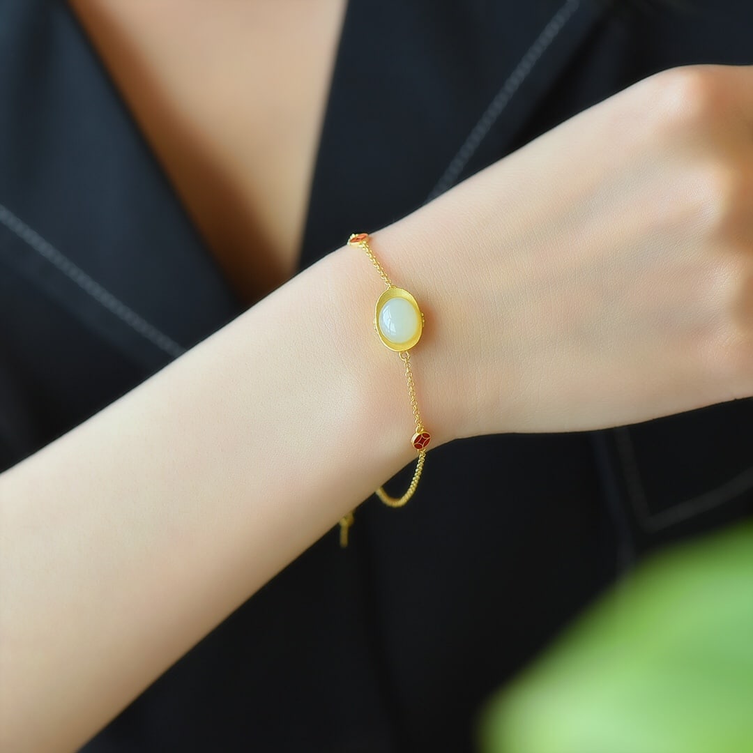 An Exquisite Sterling Silver-Gold Plated Inlaid White Jade Bracelet: An Exquisite Sterling Silver-Gold Plated Inlaid White Jade Bracelet 纯银镀金镶白玉手链