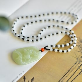 An Exquisite White Jade Mouse Pattern Pendant