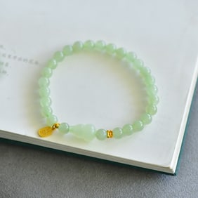 An Exquisite Greenish Jade Bracelets