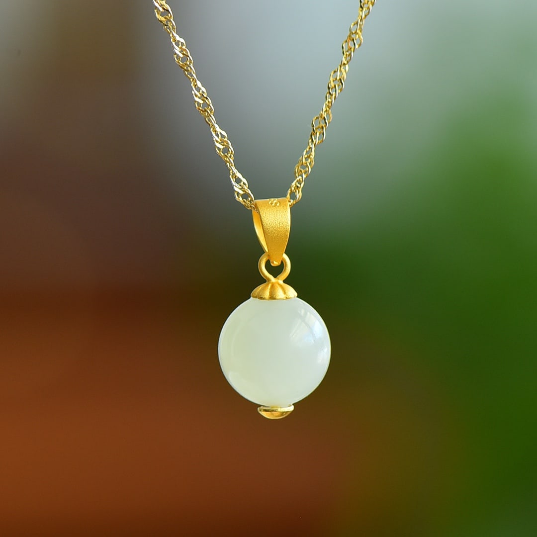 An Exquisite Sterling Silver-Gold Plated Inlaid White Jade Pendant: An Exquisite Sterling Silver-Gold Plated Inlaid White Jade Pendant,Size:10x10mm 纯银镀金镶白玉吊坠
