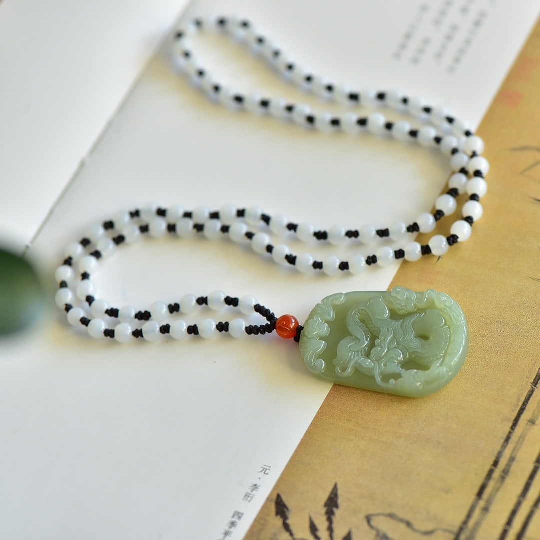 An Exquisite White Jade Dragon Pattern Pendant: An Exquisite White Jade Dragon Pattern Pendant,Size:50mmx30mm 白玉龙纹吊坠