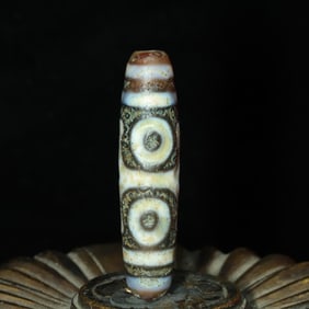 An Exquisite Three Eyes Dzi Bead Pendant