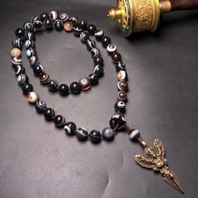 An Exquisite Inlaid Bronze Dzi Bead Necklace