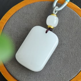 An Exquisite White Jade Pendant