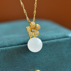 An Exquisite Sterling Silver-Gold Plated Inlaid White Jade Pendant