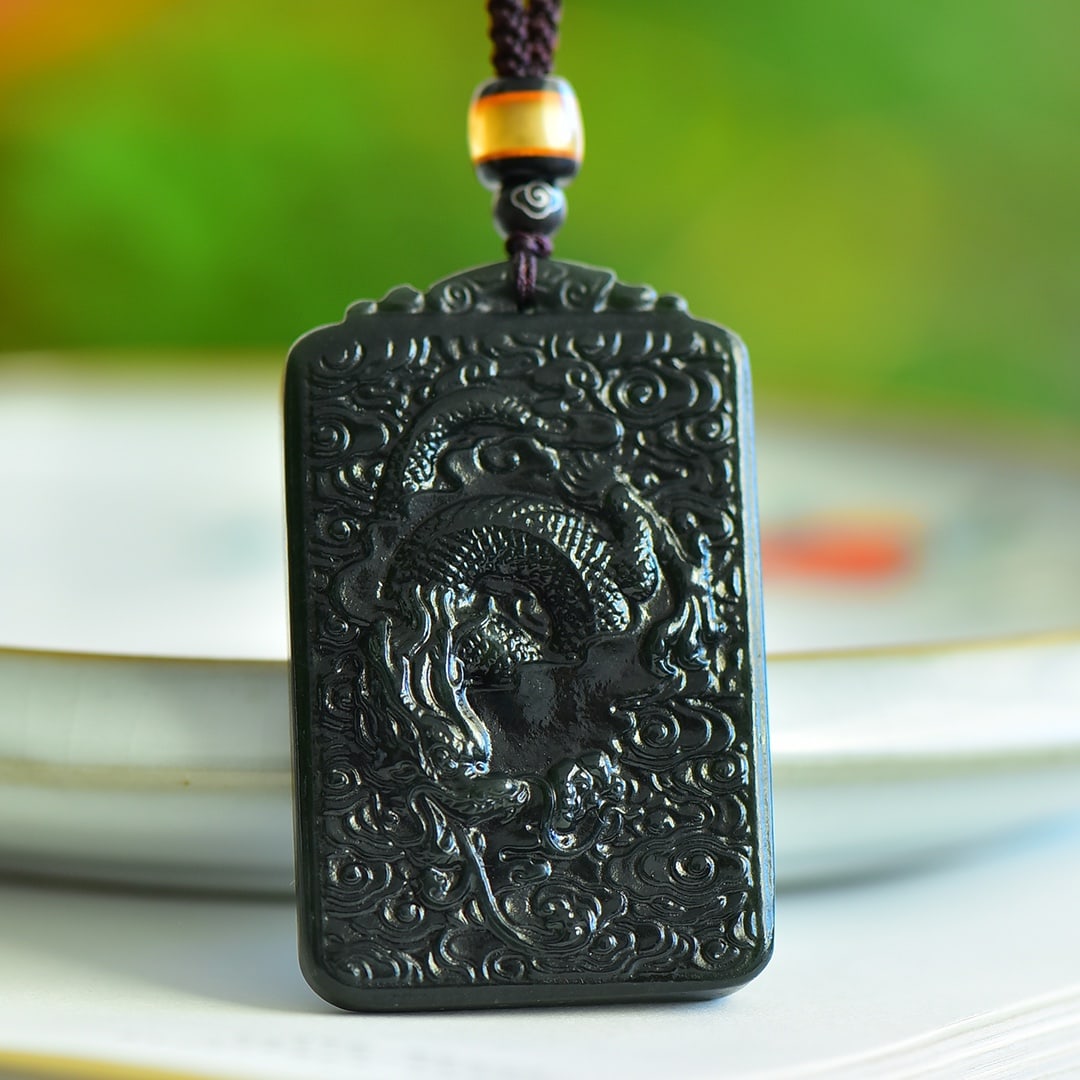 An Exquisite Sapphire Auspicious Cloud and Dragon Pattern Pendant: An Exquisite Sapphire Auspicious Cloud and Dragon Pattern Pendant 青玉祥云龙纹吊坠