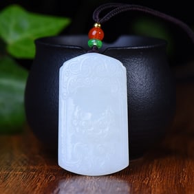 An Exquisite White Jade Beast-Face Pattern Pendant