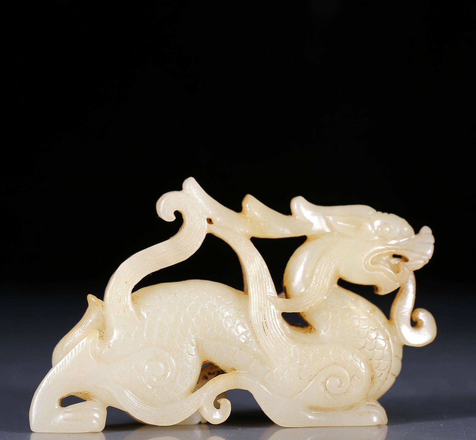 An Exquisite Greenish Jade Dragon Ornament: An Exquisite Greenish Jade Dragon Ornament,Qing Dynasty, China,Size:3.9inx0.8inx2.4in,Weight:110g 青玉龙摆件，清代