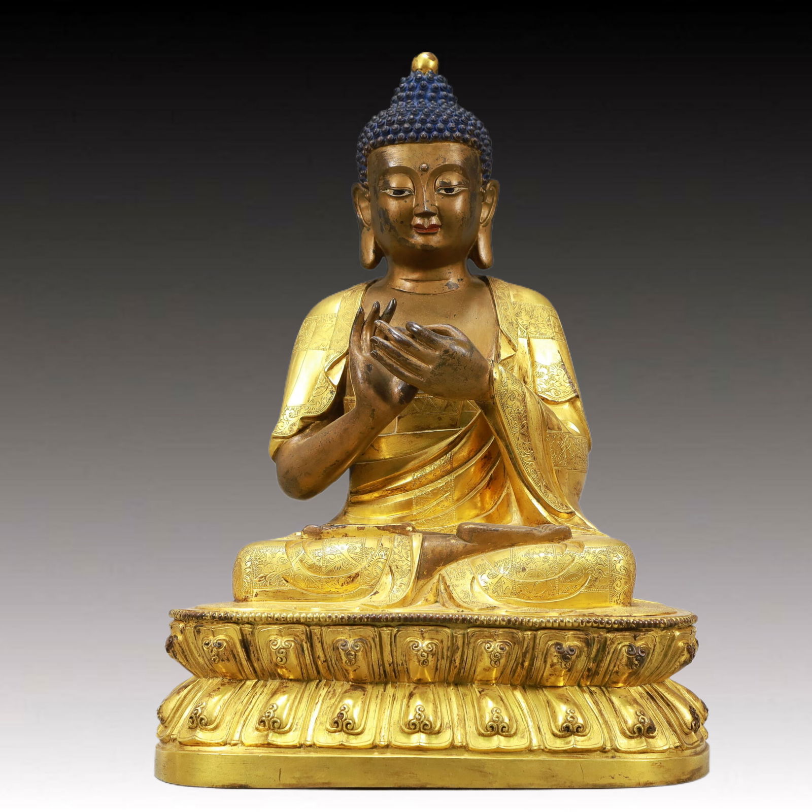 A Solemn Gilt Bronze Statue of Sakyamuni: A Solemn Gilt Bronze Statue of Sakyamuni,Ming Dynasty, China,Size:11inx8.7inx15.2in,Weight:11495g 铜鎏金释迦摩尼像,中国明代