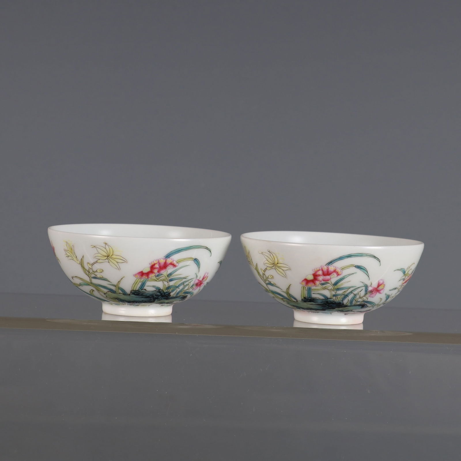A Pair of Exquisite Famille-Rose Orchid Pattern Cups: A Pair of Exquisite Famille-Rose Orchid Pattern Cups,Qing Dynasty, China,Yongzheng Four-character Mark,Size:1.2inx2.6in 